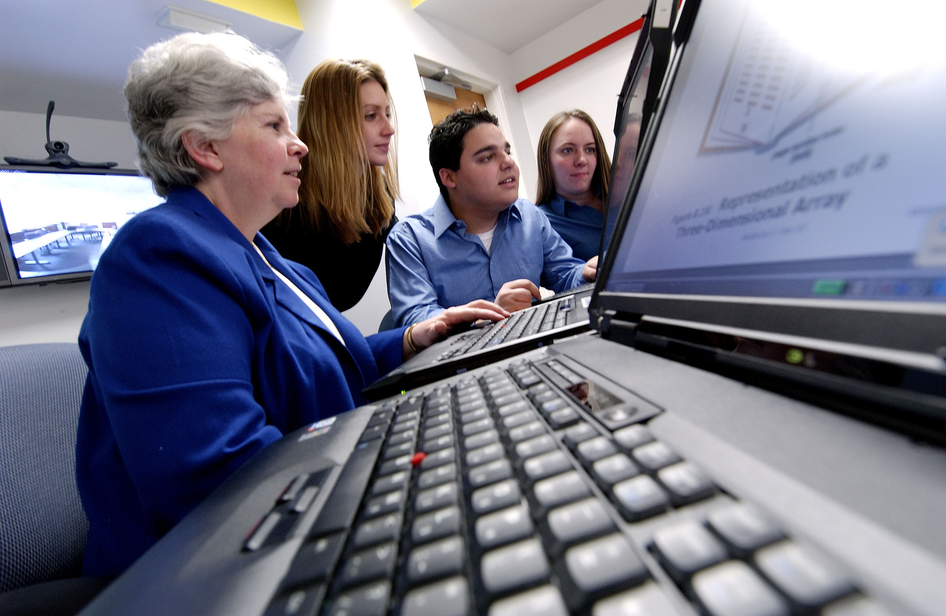 S. Jane Fritz in a computer lab with students.