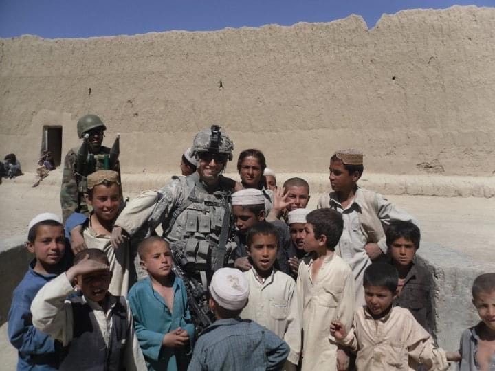 Davis with children in Afghanistan.