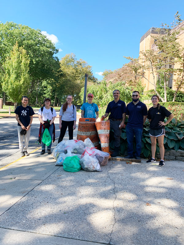 SJC community with trash they collected during the event.