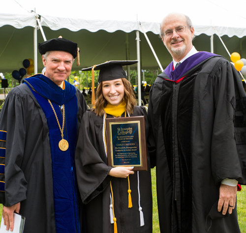 Carly Credidio with SJC President Donald R. Boomgaarden, Ph.D., and Chair of the Board of Trustees Christopher Carroll, Esq.